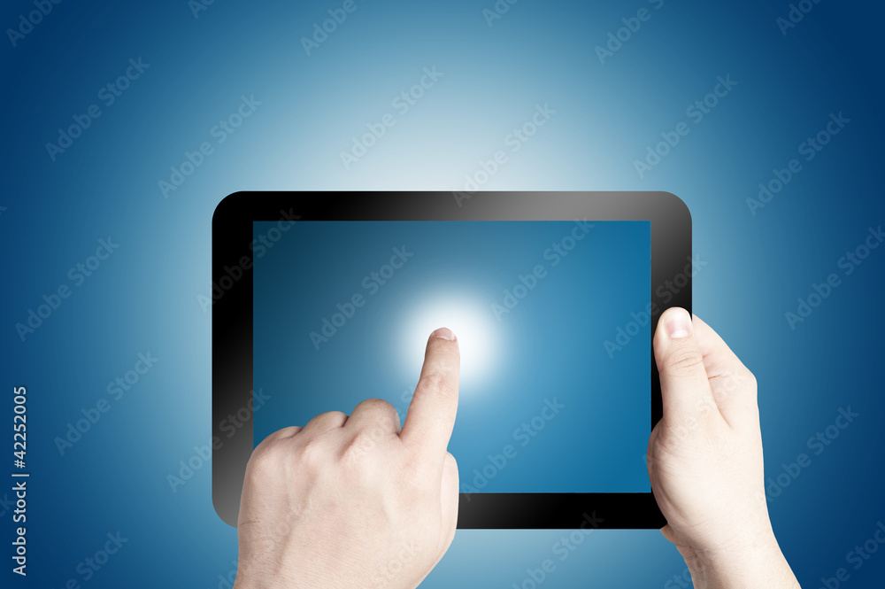 hand Holding Tablet PC on blue background hand Holding Tablet PC on blue background