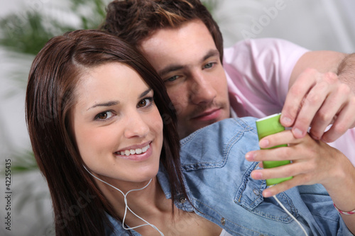 Smiling girl with mp3 player