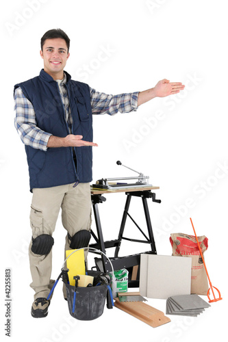 Proud tradesman showing off his tools