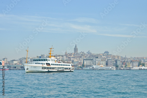 White cruise ship in Bosporus with Galata Tower background © Nadiyka