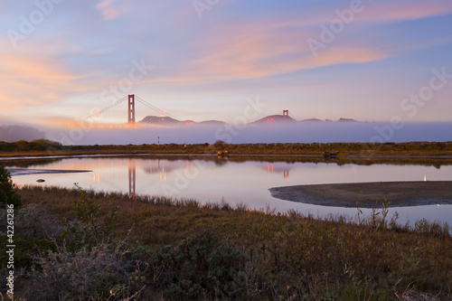 golden Gate Bridge at sunset © somchaij