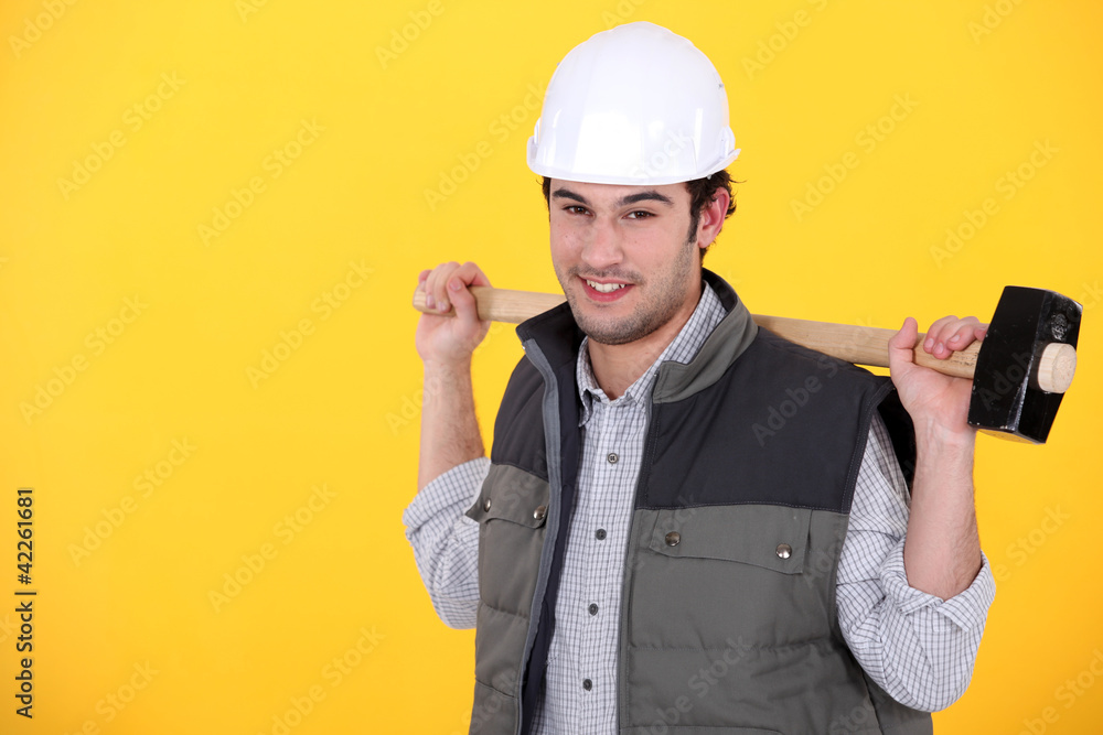 Tradesman carrying a mallet
