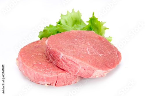 Raw beef steak over white