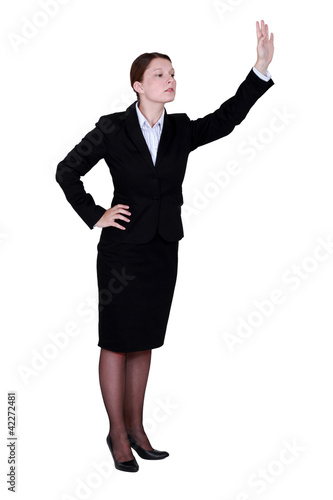 Businesswoman waving someone down