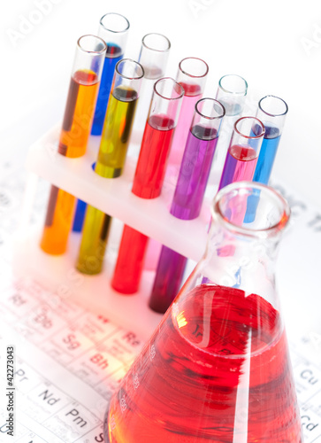Group of test tubes and flask with colored liquids