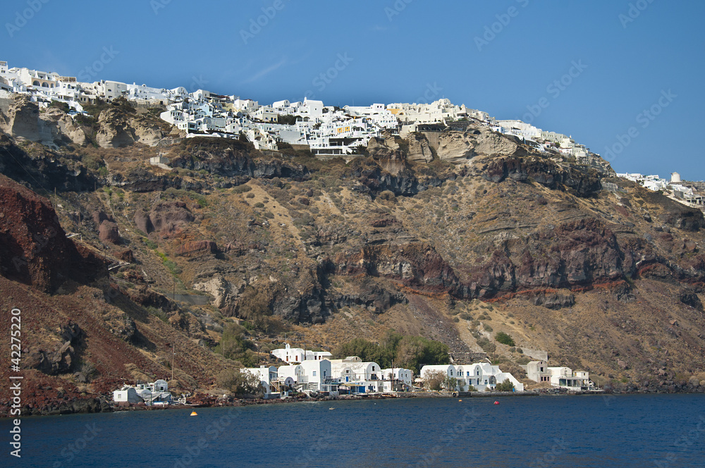 Oia clinging to the clifftops on island of Santorini Greece