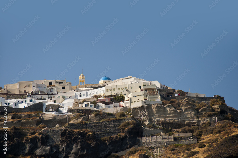 Oia clinging to the clifftop on the island of Santorini Greece