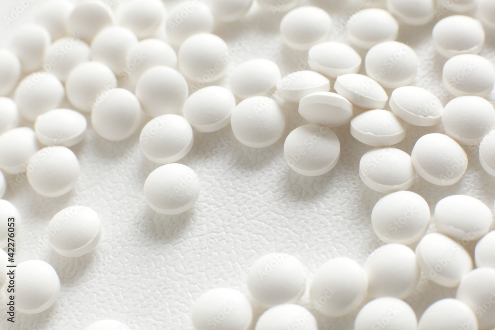 White pill close up with copy space for medical image White pill close up with copy space for medical image