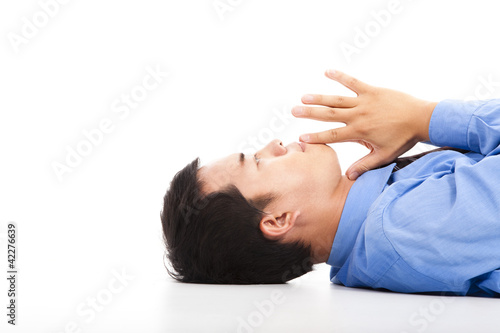 asian businessman lying on floor with thinking