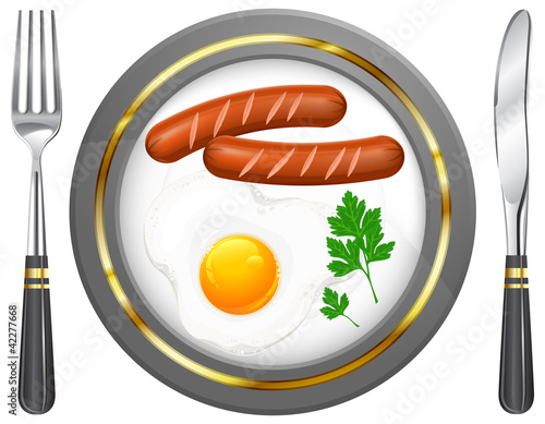 Fried eggs and sausage on plate