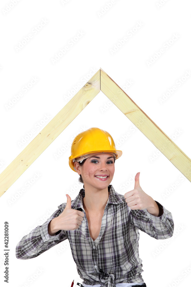 Female builder with a timber A-frame Female builder with a timber A-frame
