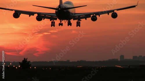 Jumbojet landing at dusk