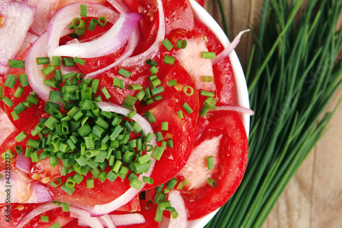 healthy appetizer : fresh tomato salad in white bowl