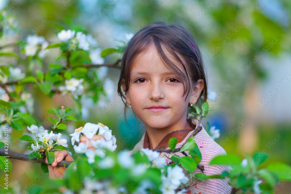 portrait of a young girl in a blossom apple garden portrait of a young girl in a blossom apple garden