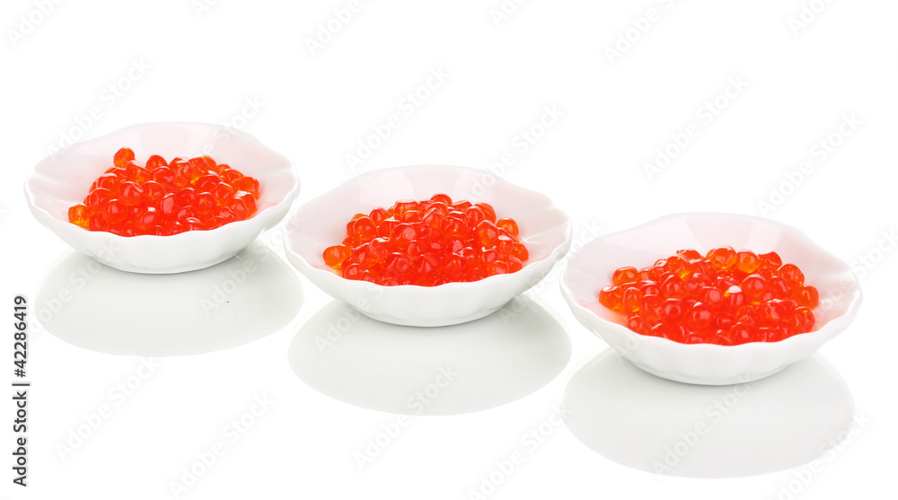 Red caviar in white bowls isolated on white Red caviar in white bowls isolated on white