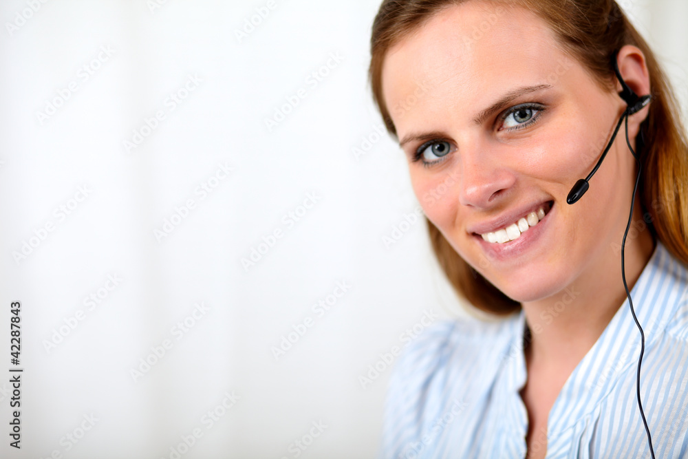 Friendly blonde secretary smiling and talking Friendly blonde secretary smiling and talking