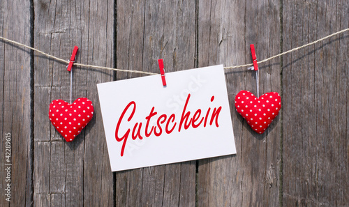 Gutschein mit roten Herzen photo