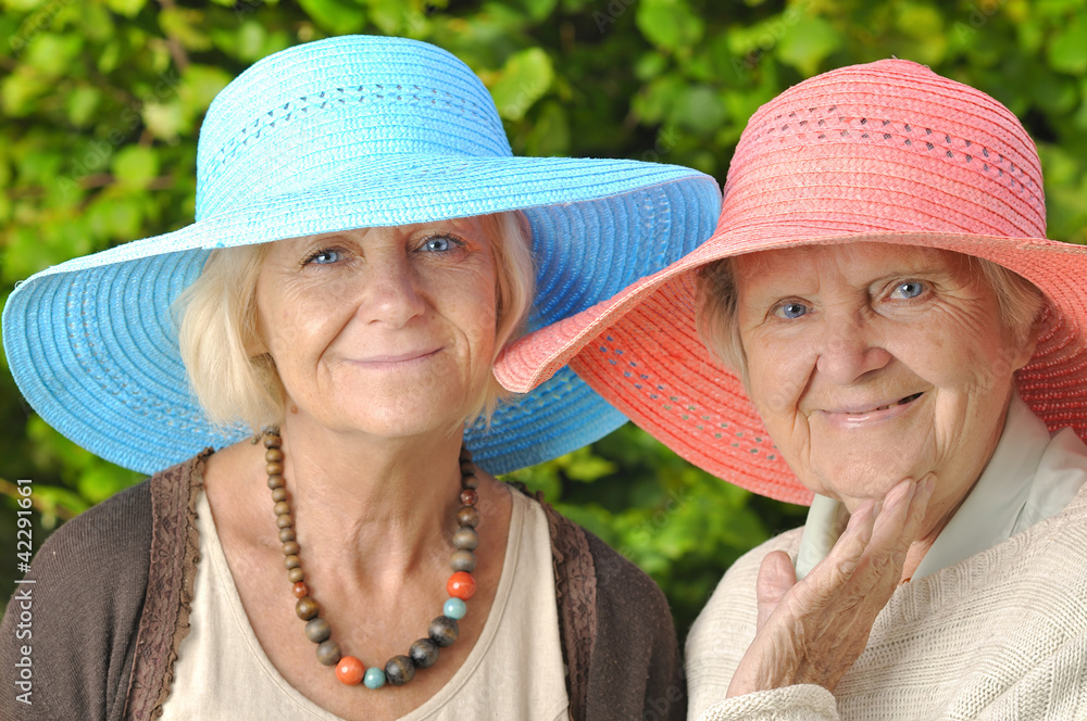 Happy women in hats.