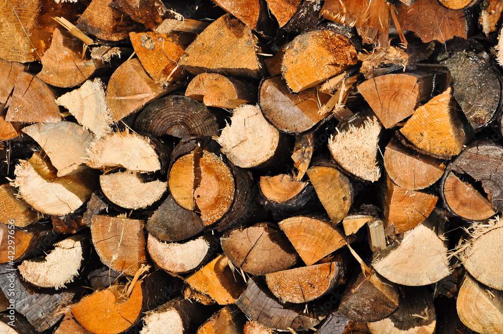 neatly stacked logs of firewood neatly stacked logs of firewood