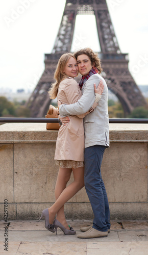 Romantic couple in Paris by the Eiffel Tower