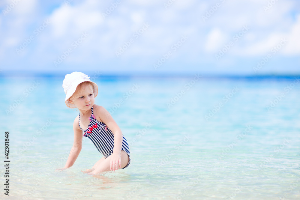 Little girl at tropical beach