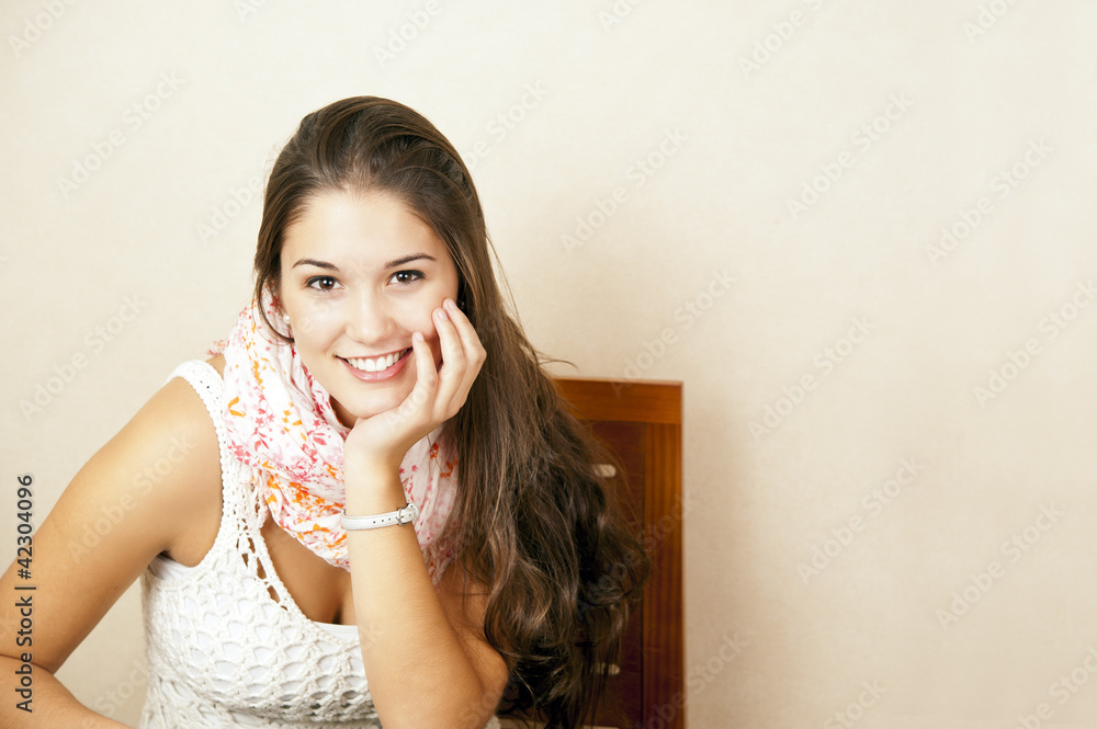 Beautiful young woman sitting in a chair Beautiful young woman sitting in a chair
