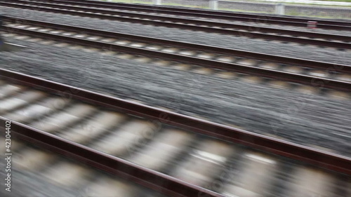 Close view of railroad track moving at high speed
