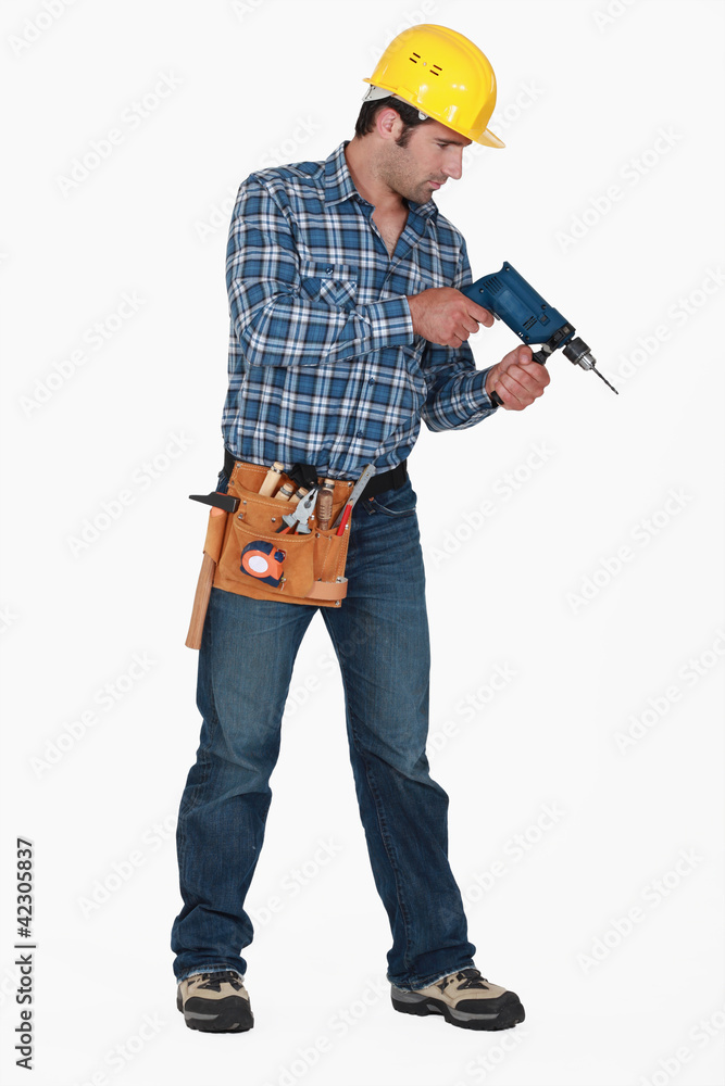 Man holding drill Man holding drill