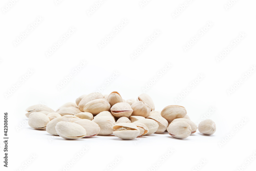 pistachios heap against white background pistachios heap against white background
