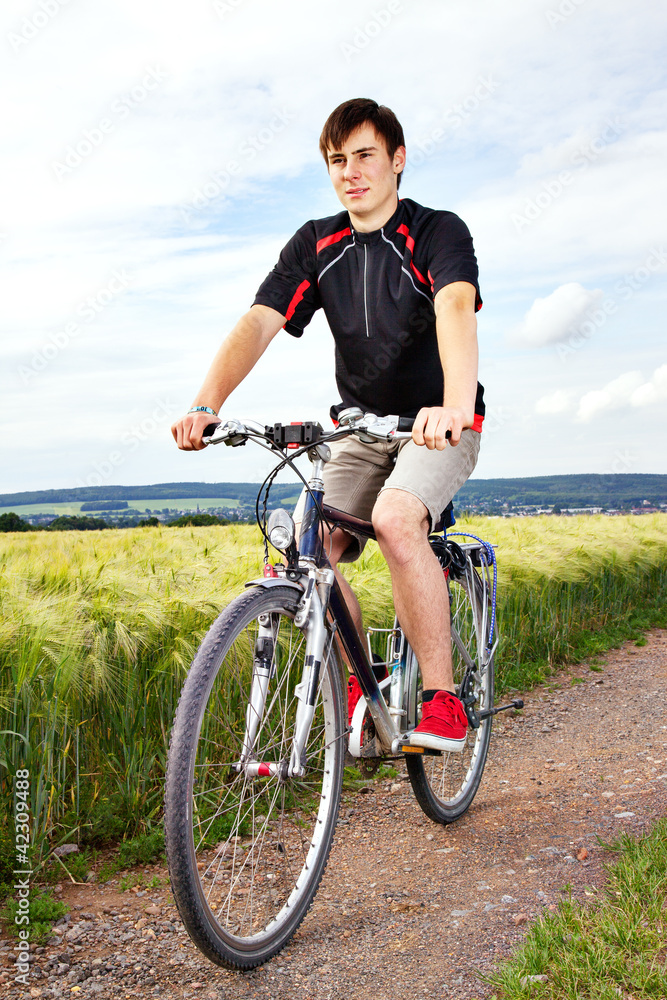 Young man riding a bicycle