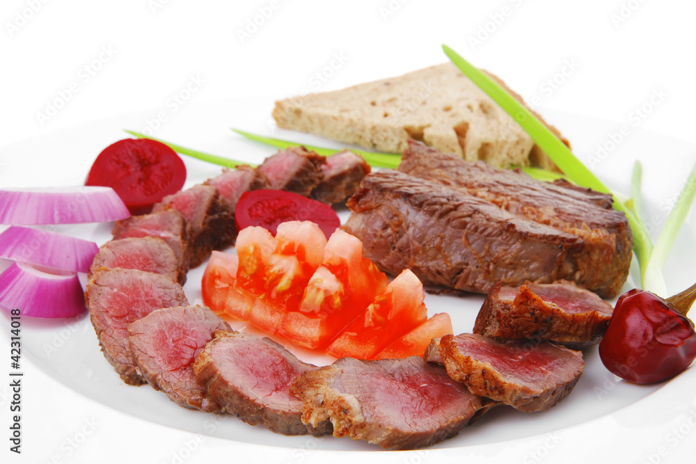 meat food : roast red meat slices served on white plate