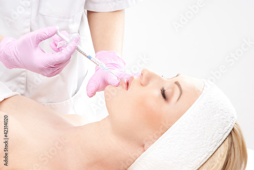 Portrait of a young woman on a botox injection procedure