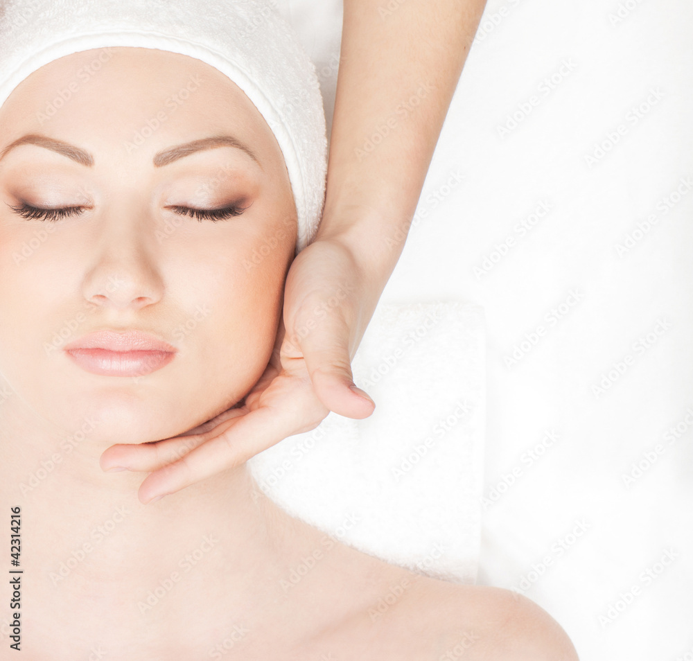 Portrait of a young woman laying on a spa procedure Portrait of a young woman laying on a spa procedure