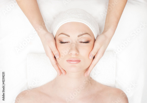 Portrait of a young woman laying on a spa procedure