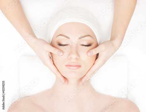 Portrait of a young woman laying on a spa procedure