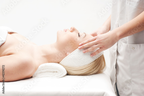 Portrait of a young woman laying on a spa procedure