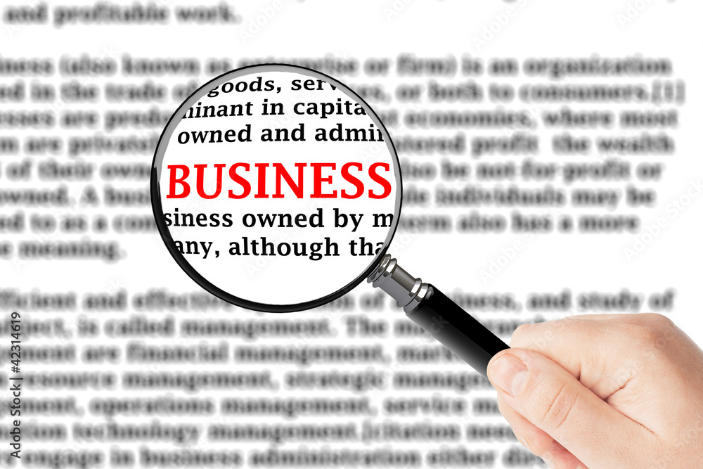 Magnifying glass and business sign Magnifying glass and business sign