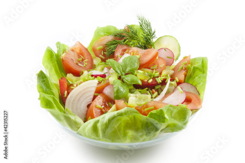 fresh spring vegetables salad in bowl
