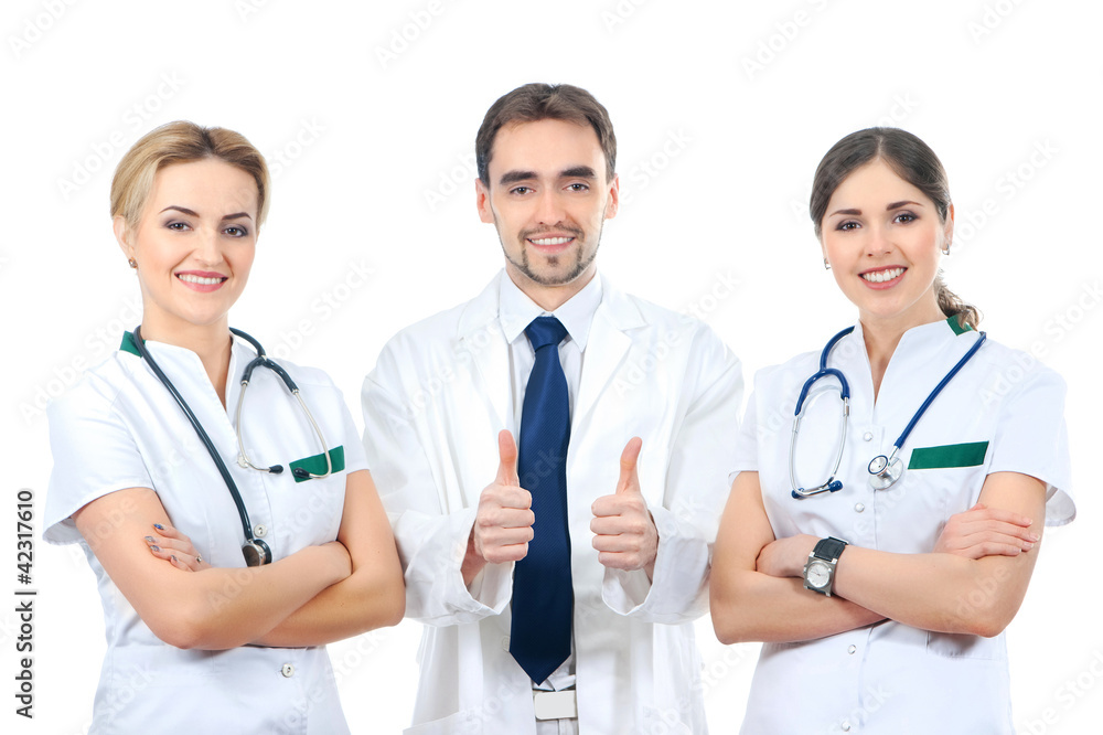 A team of three young Caucasian doctors in white clothes A team of three young Caucasian doctors in white clothes
