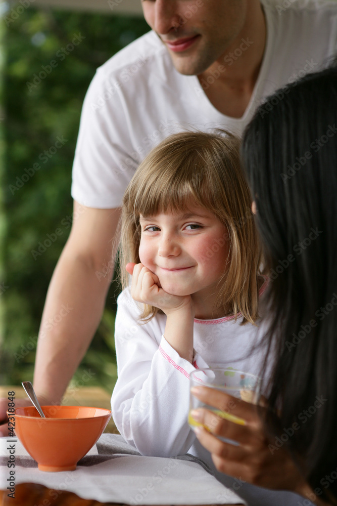 Yougn family having breakfast in the garden Yougn family having breakfast in the garden