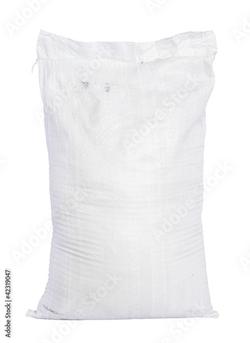 White canvas sack with full fertilizer isolated on white backgro photo