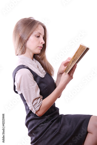 Young woman reading a book, isolated