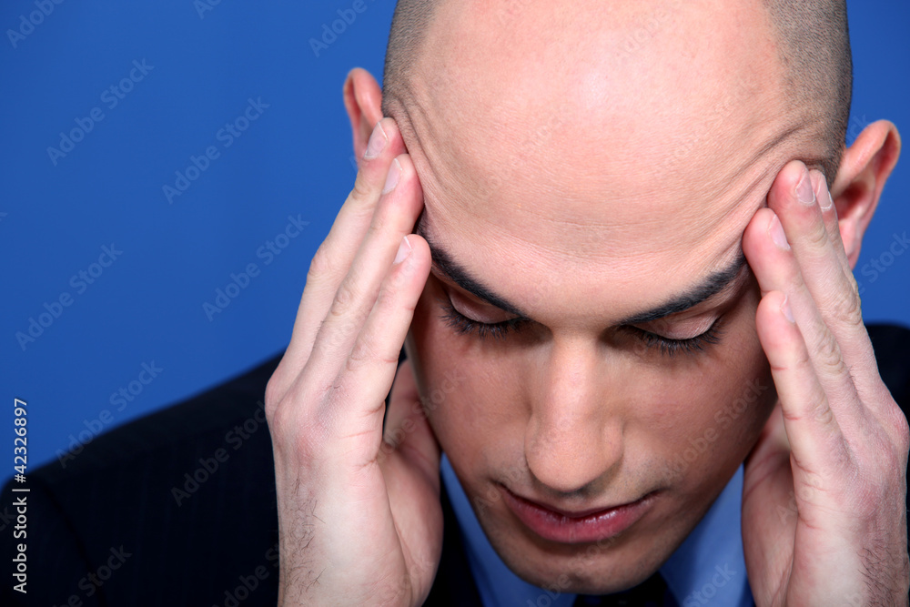 businessman having a head ache businessman having a head ache