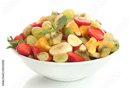 bowl with fresh fruits salad  isolated on white