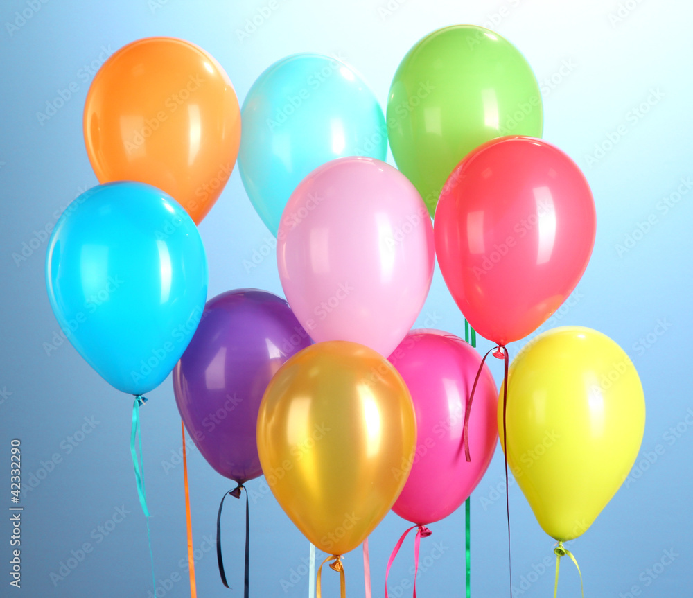 colorful balloons on blue background close-up colorful balloons on blue background close-up