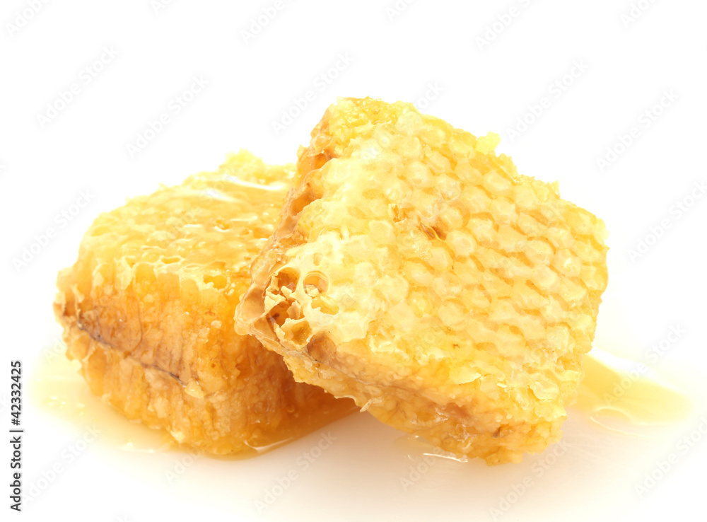 golden honeycombs with honey isolated on white.
