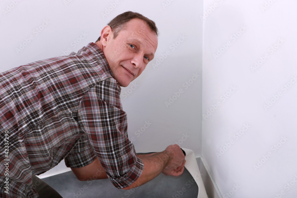 Man laying carpet Man laying carpet