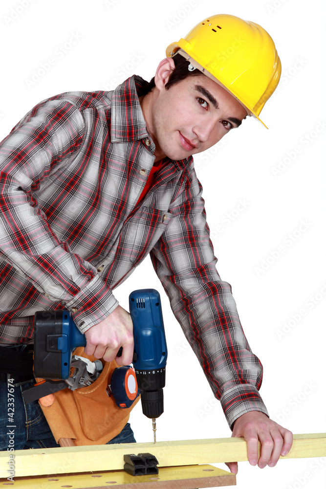 Man drilling wood Man drilling wood