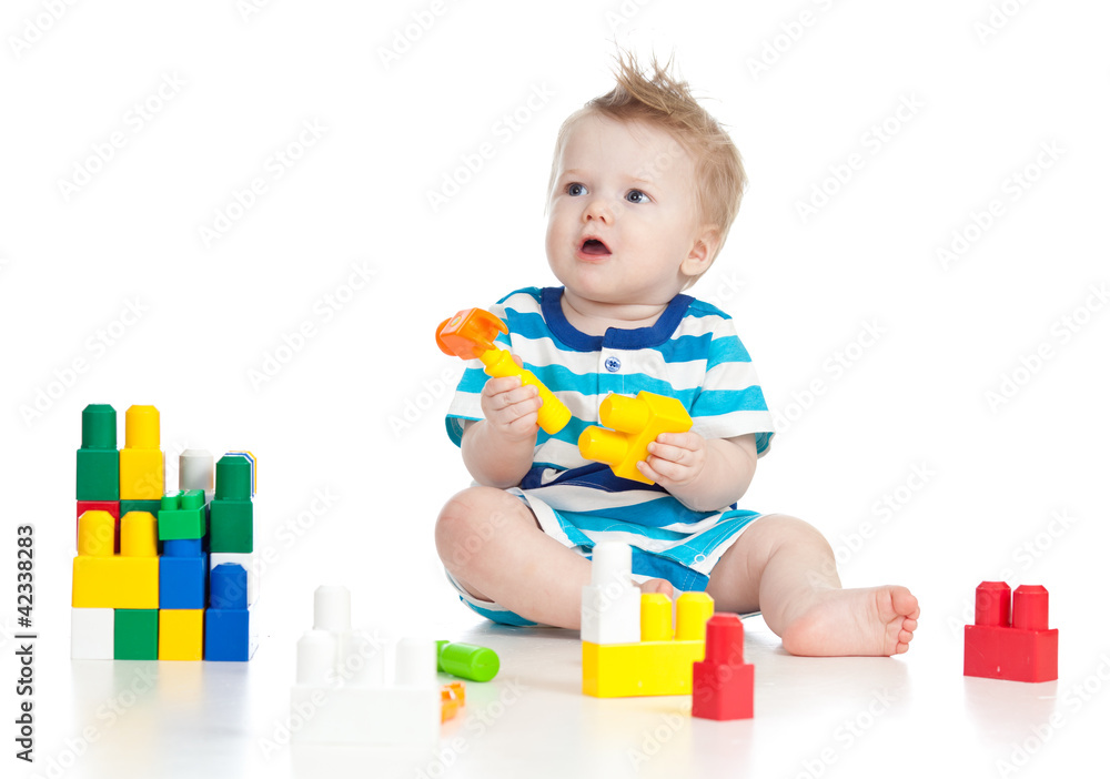 cheerful child boy playing with construction set over white back cheerful child boy playing with construction set over white back