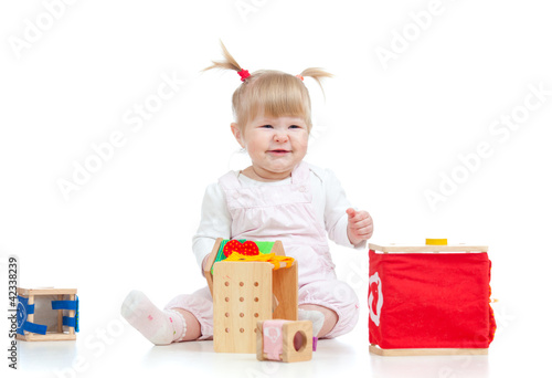 funny baby girl playing wit...